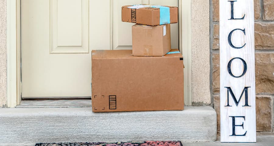 Deliveries on the front porch of a house with a welcome sign in Lexington